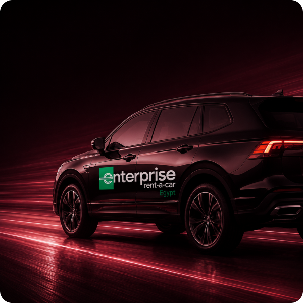 Enterprise Rent-A-Car vehicle in a red-lit campaign scene